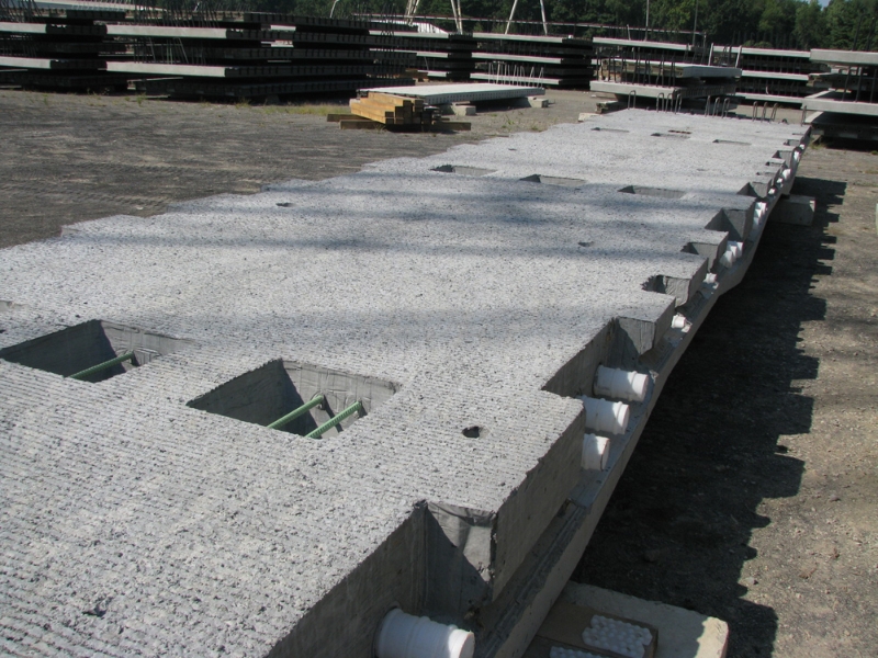 Precast post-tensioned bridge deck panels aligned for overnight installation to minimize disruption to rail traffic