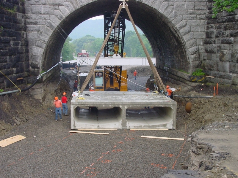 Box Culvert being placed with crane under bridge