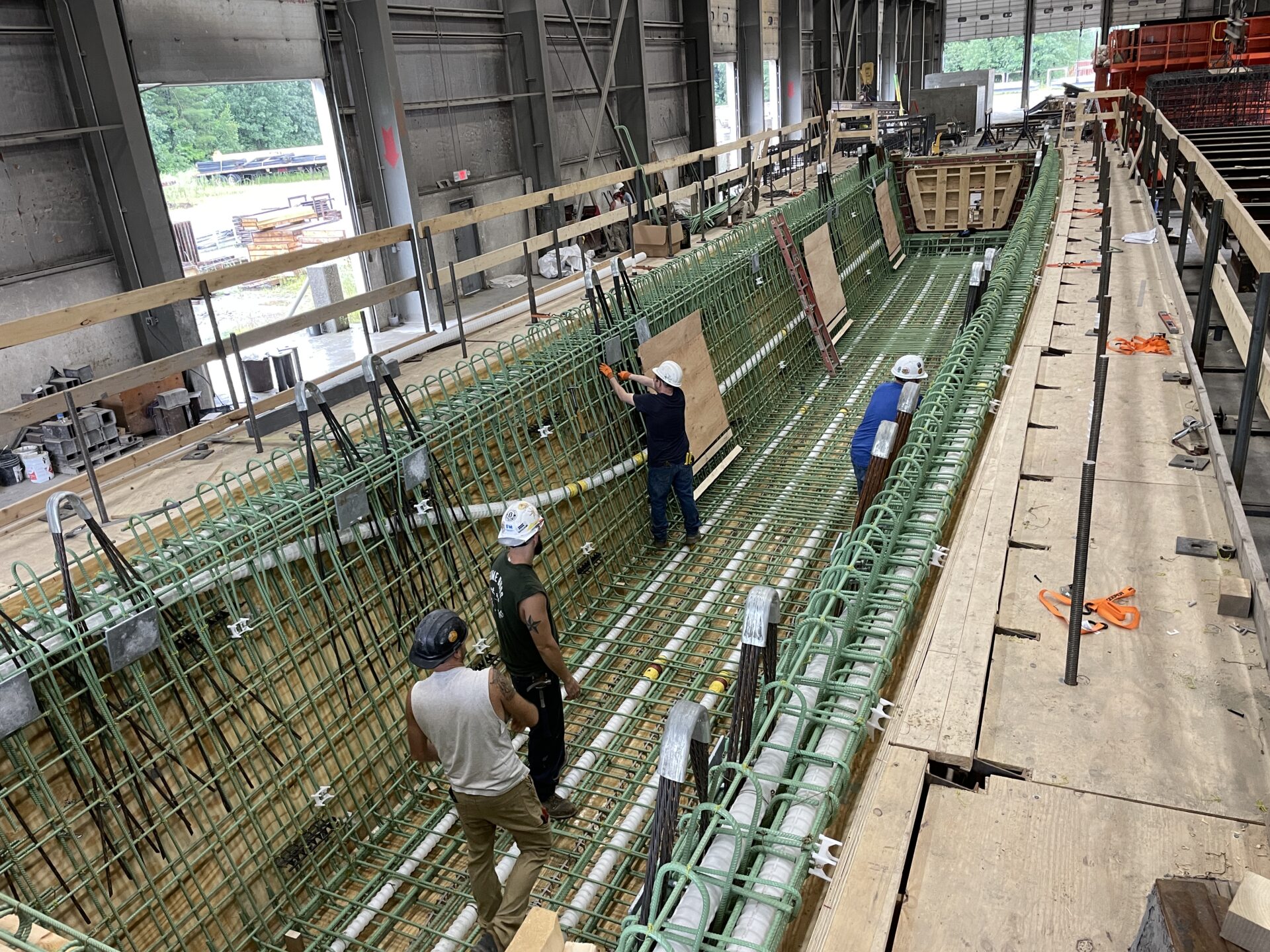 Curved precast concrete girders being produced