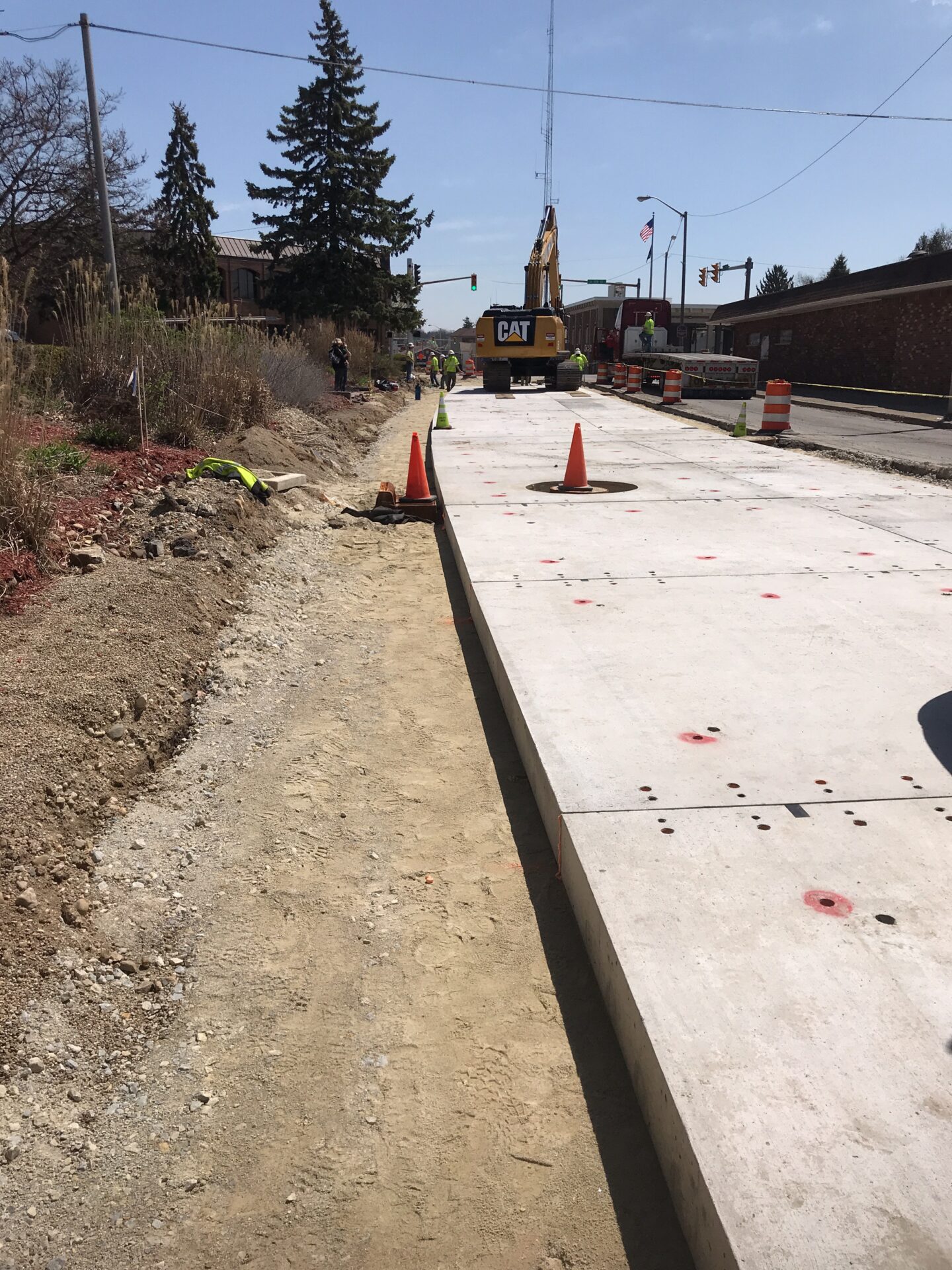 Crews install removable precast concrete pavement panels